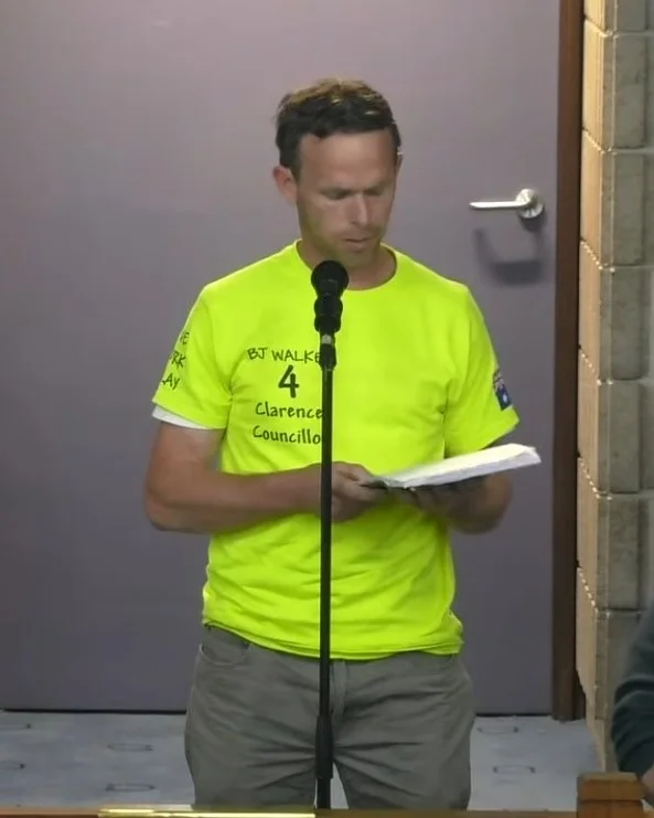 BJ Walker speaking at a microphone