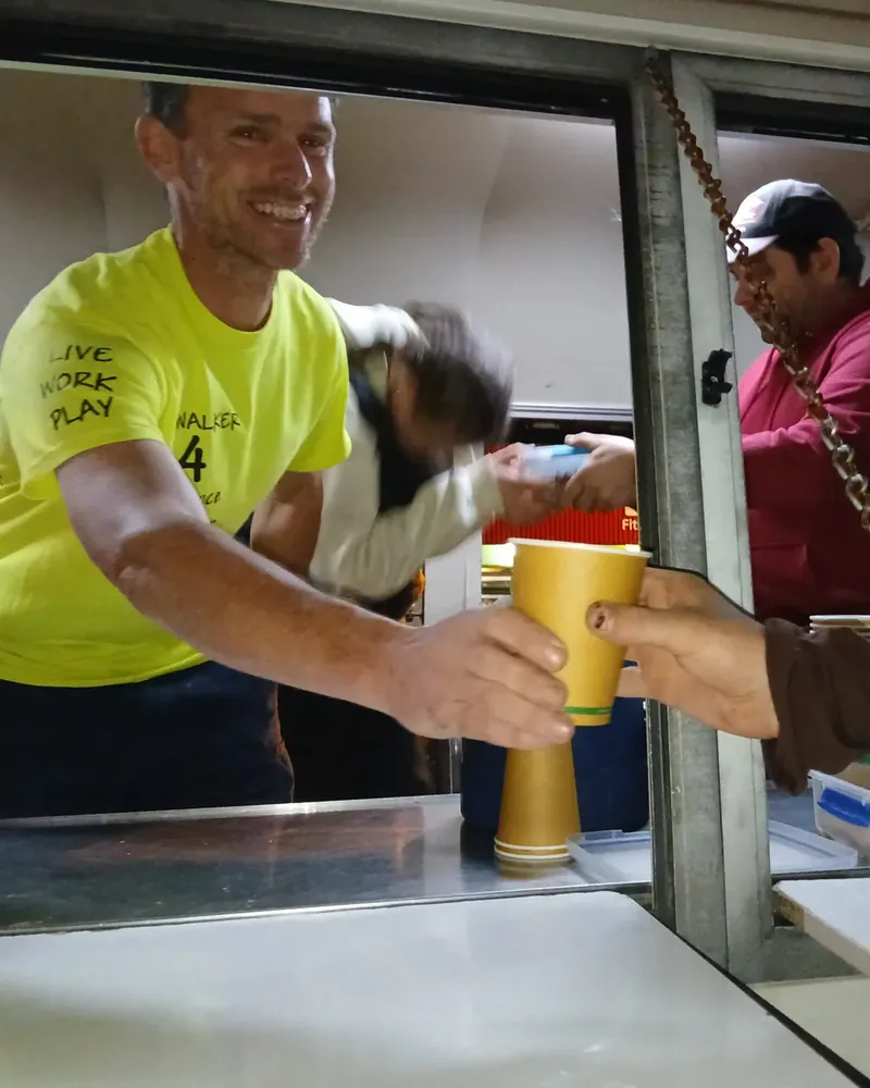 BJ Walker serving a drink from the Danny's Bus window